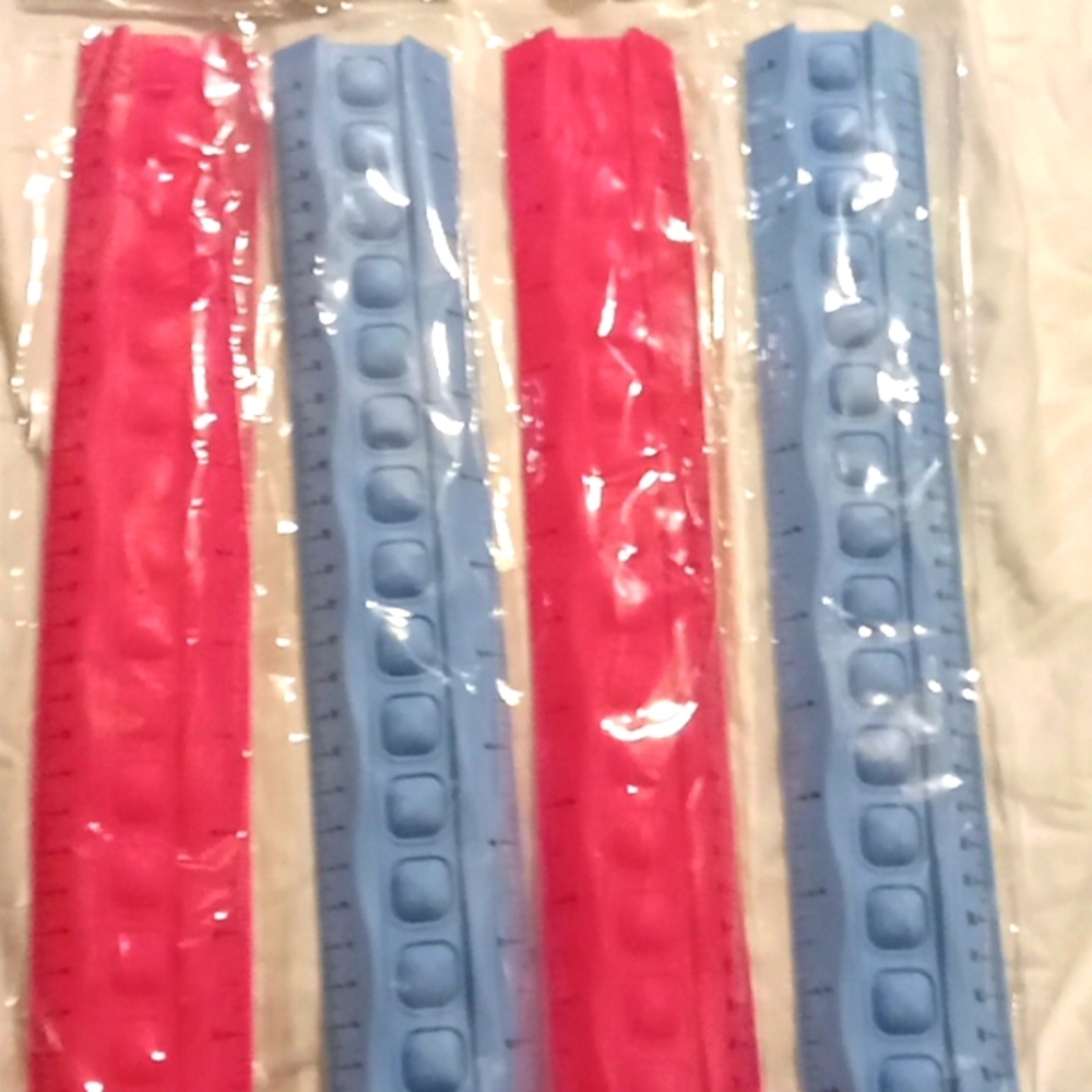 4 pop it sensory rulers